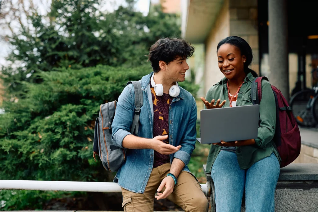 Two students looking at laptop